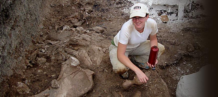 Student with bones at field site in Ecuador